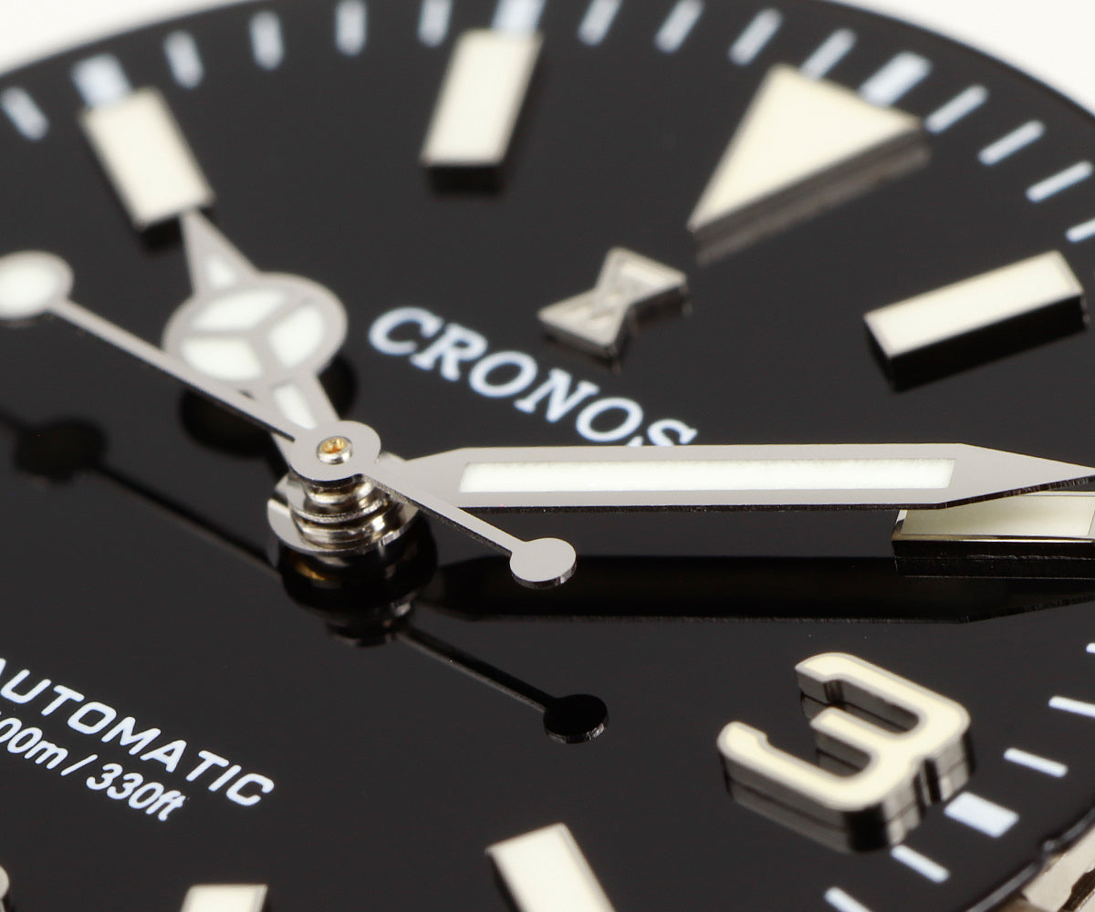 Cronos L6032 black dial close-up showing applied hour markers and hands